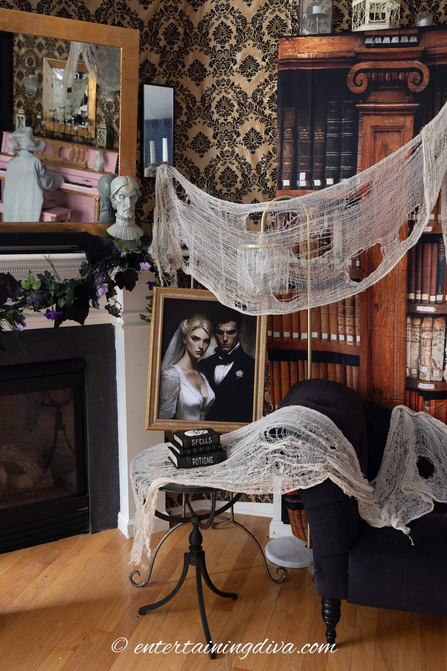An old bride and groom picture with spooky spider webs and an old bookshelf